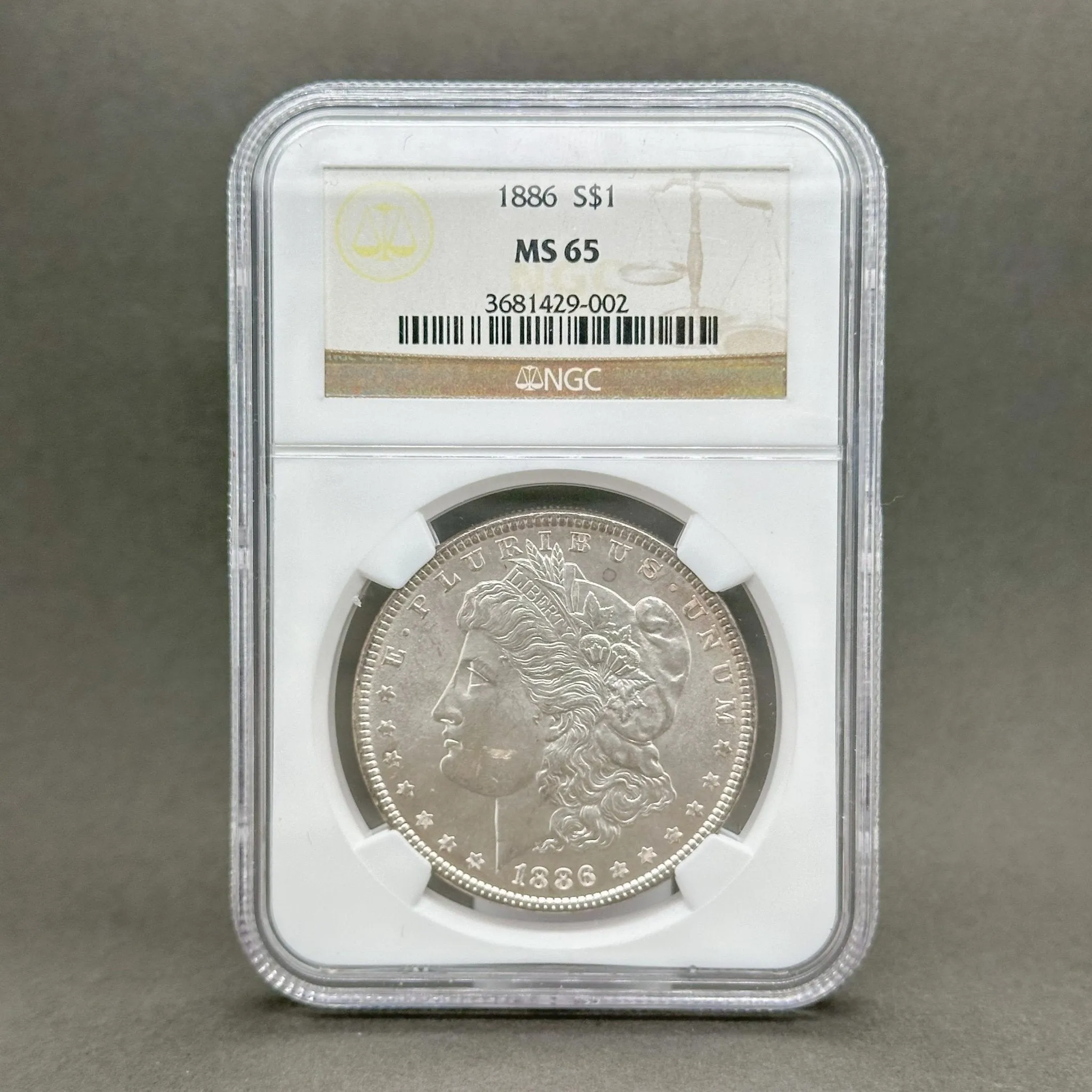 Estate 0.900 Fine Silver 1886 Morgan $1 NGC MS65 Dollar Coin