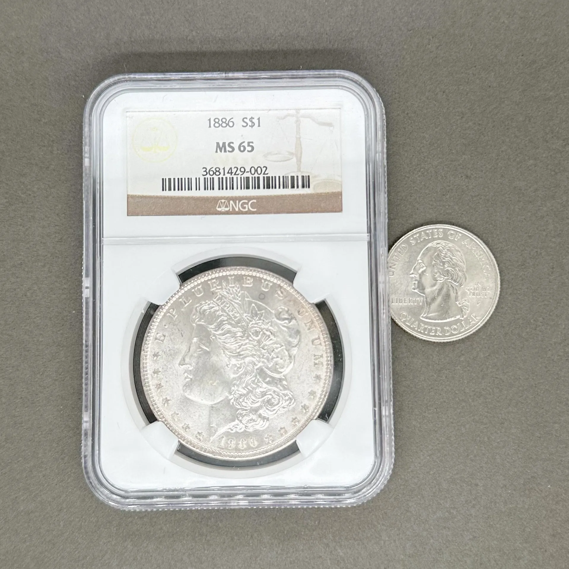 Estate 0.900 Fine Silver 1886 Morgan $1 NGC MS65 Dollar Coin